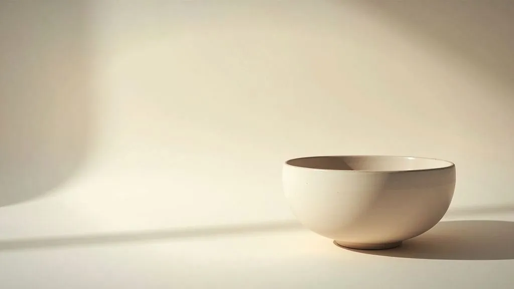 Artisan shaping clay on a pottery wheel